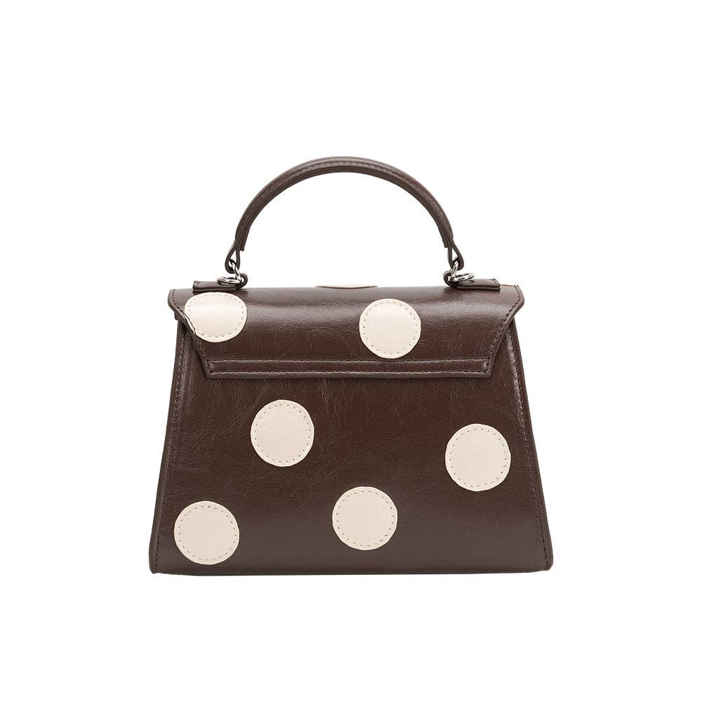 brown hand bag with cream polka dots