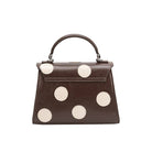 brown hand bag with cream polka dots