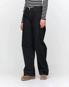 woman wearing dark grey wide-leg jeans