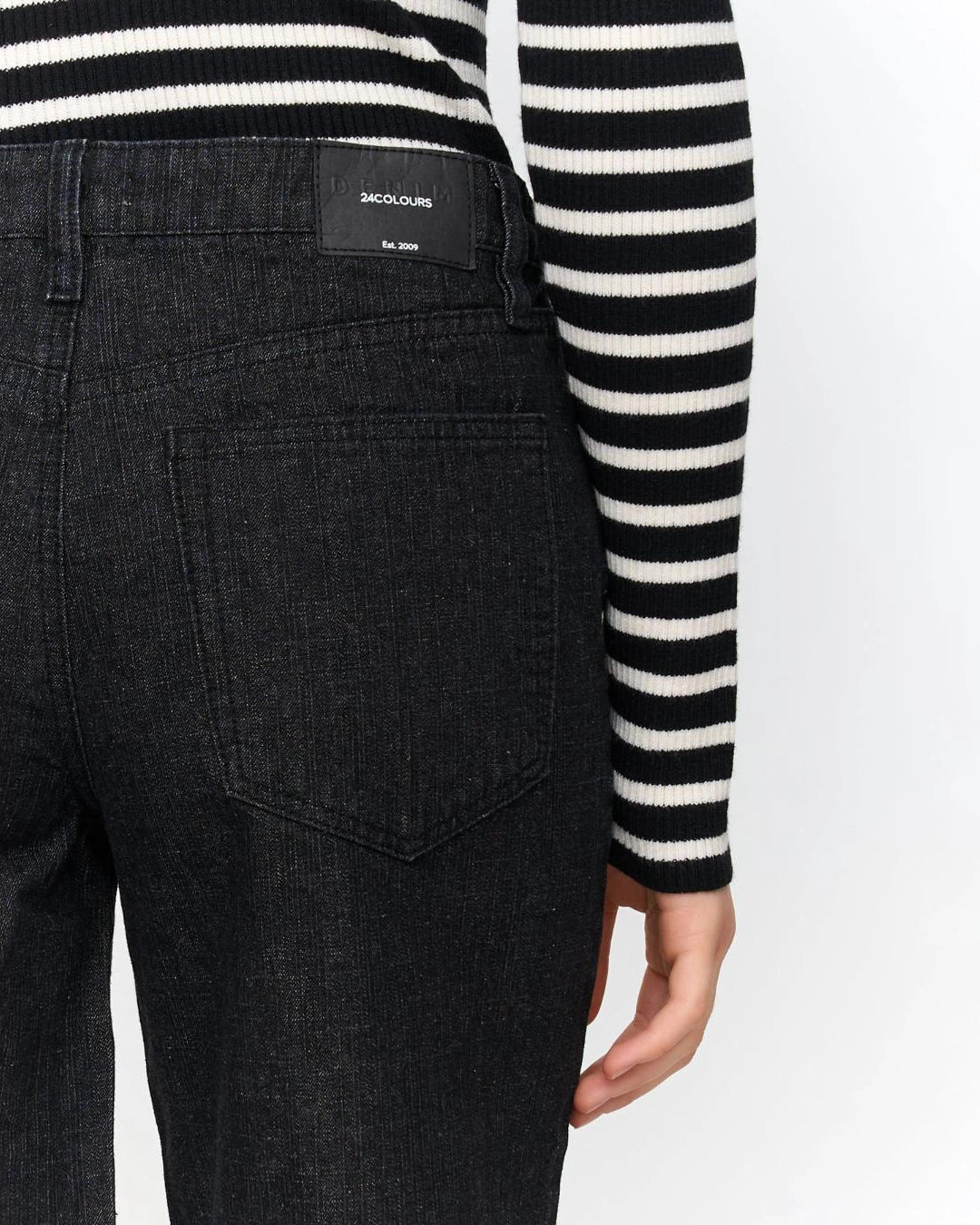 woman wearing dark grey wide-leg jeans