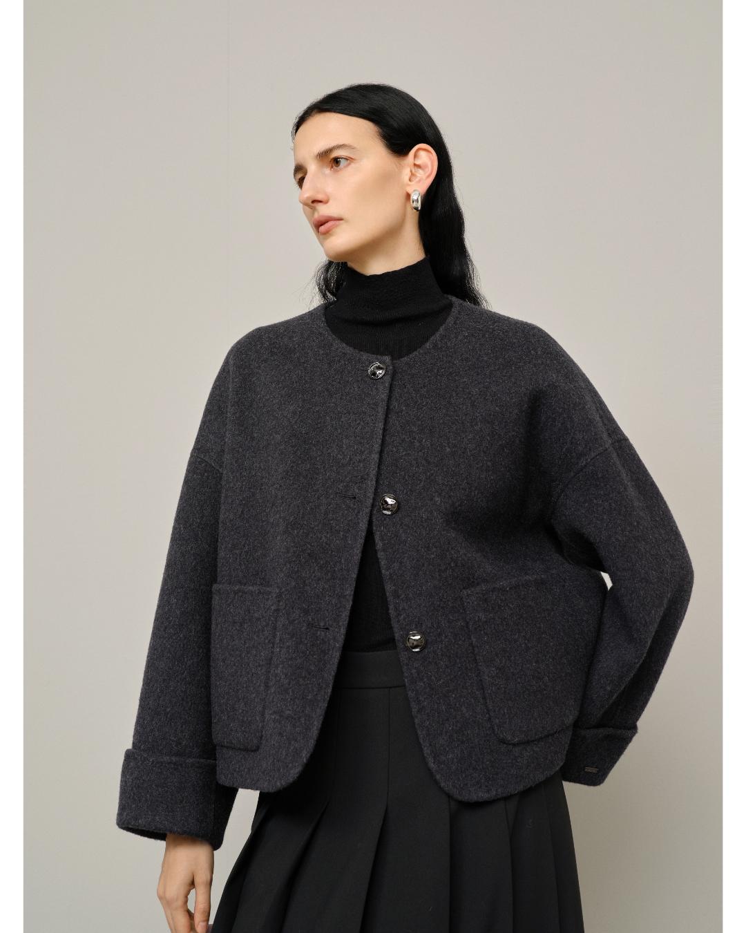 dark grey jacket with pockets and large buttons