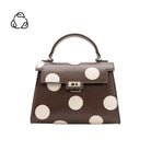 brown hand bag with cream polka dots
