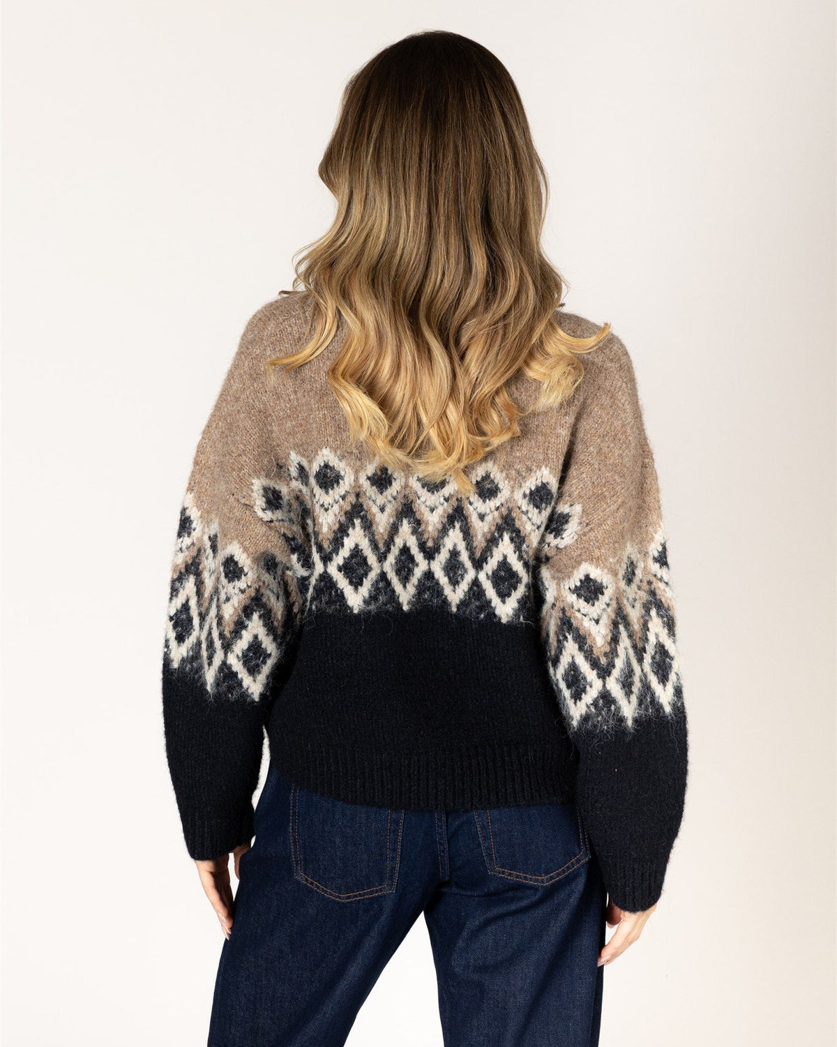 fairisle knit sweater in brown on the top and black on the bottom