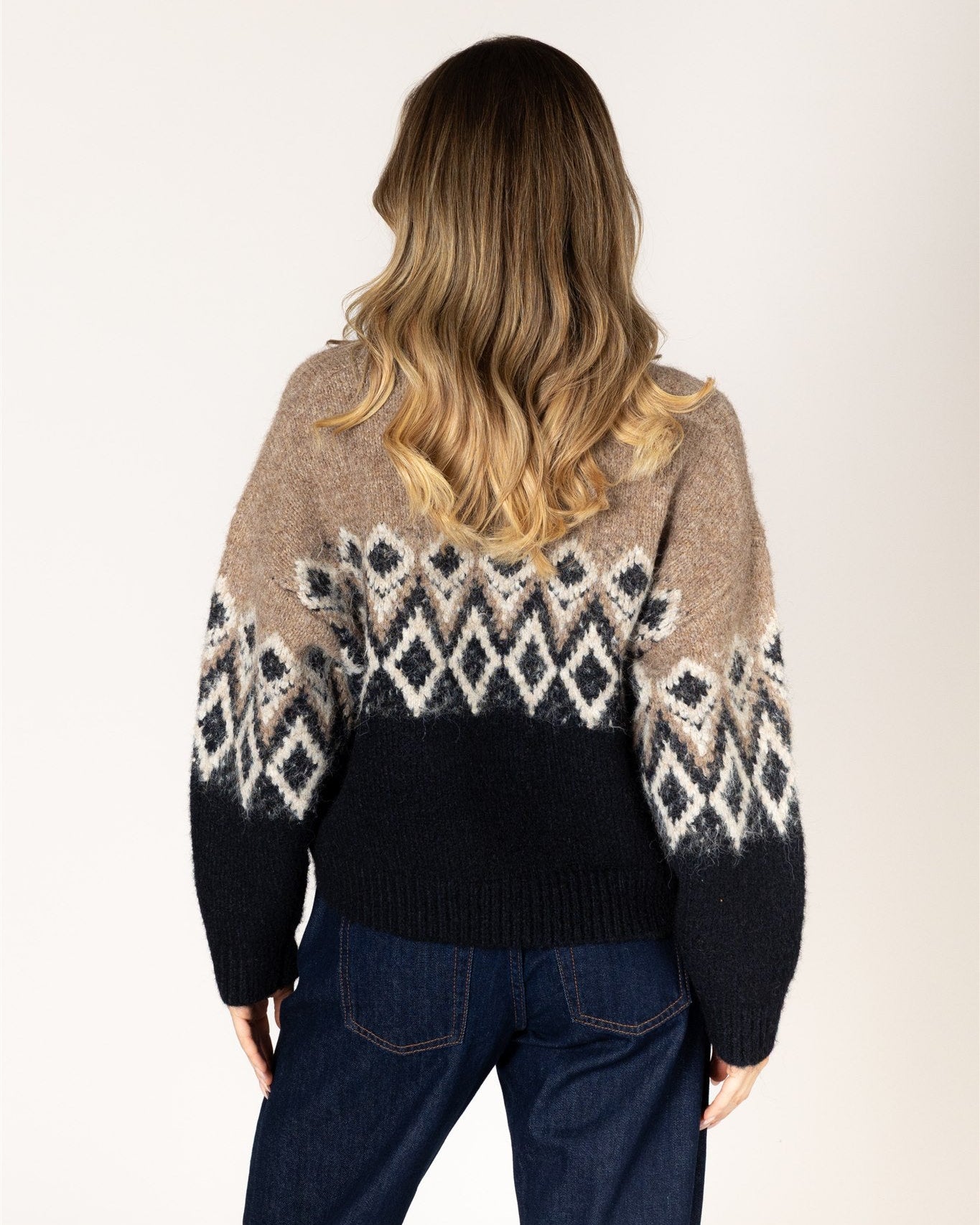 fairisle knit sweater in brown on the top and black on the bottom