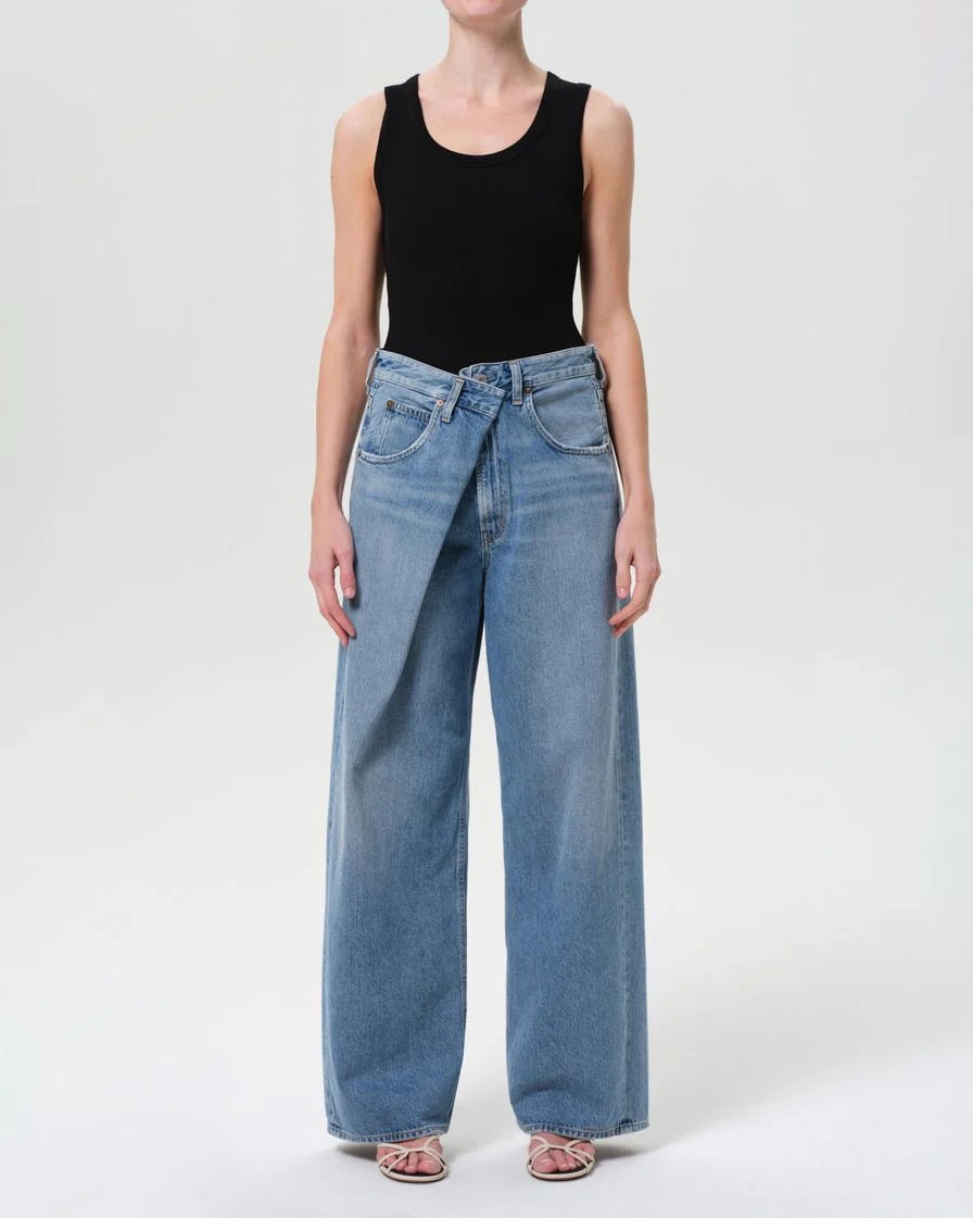 a woman wearing foldover wide leg jeans by Agolde