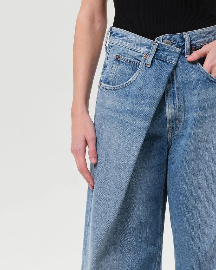 a woman wearing foldover wide leg jeans by Agolde