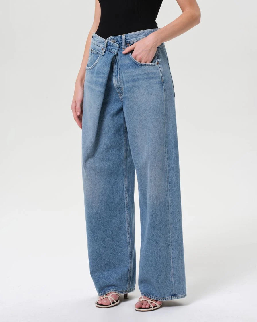 a woman wearing foldover wide leg jeans by Agolde