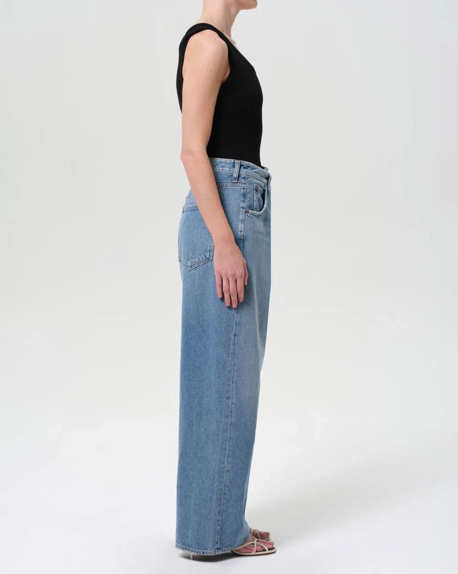 a woman wearing foldover wide leg jeans by Agolde