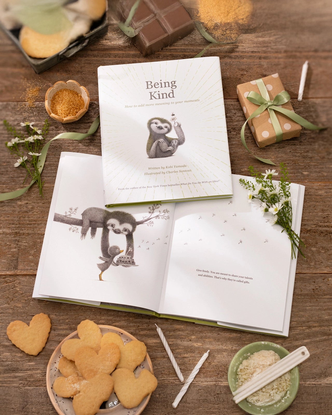Flat lay shots of children's Book called 'Being Kind: How to add more meaning to your moments' by Kobi Yamada with a sloth listening to a duck