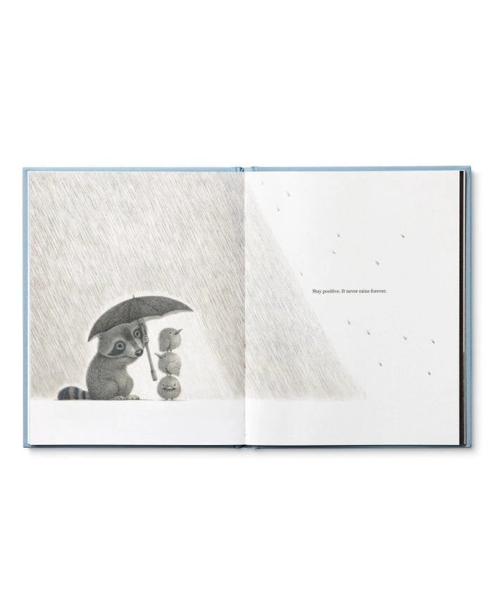 Page of Children's Book called 'Chasing Dreams: how to add more daring to your doing' by Kobi Yamada with a raccoon holding an umbrella in the rain over 3 chicks