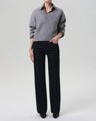 a woman wears a dark wash straight legged jean by Citizens of Humanity