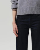 a woman wears a dark wash straight legged jean by Citizens of Humanity