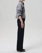 a woman wears a dark wash straight legged jean by Citizens of Humanity