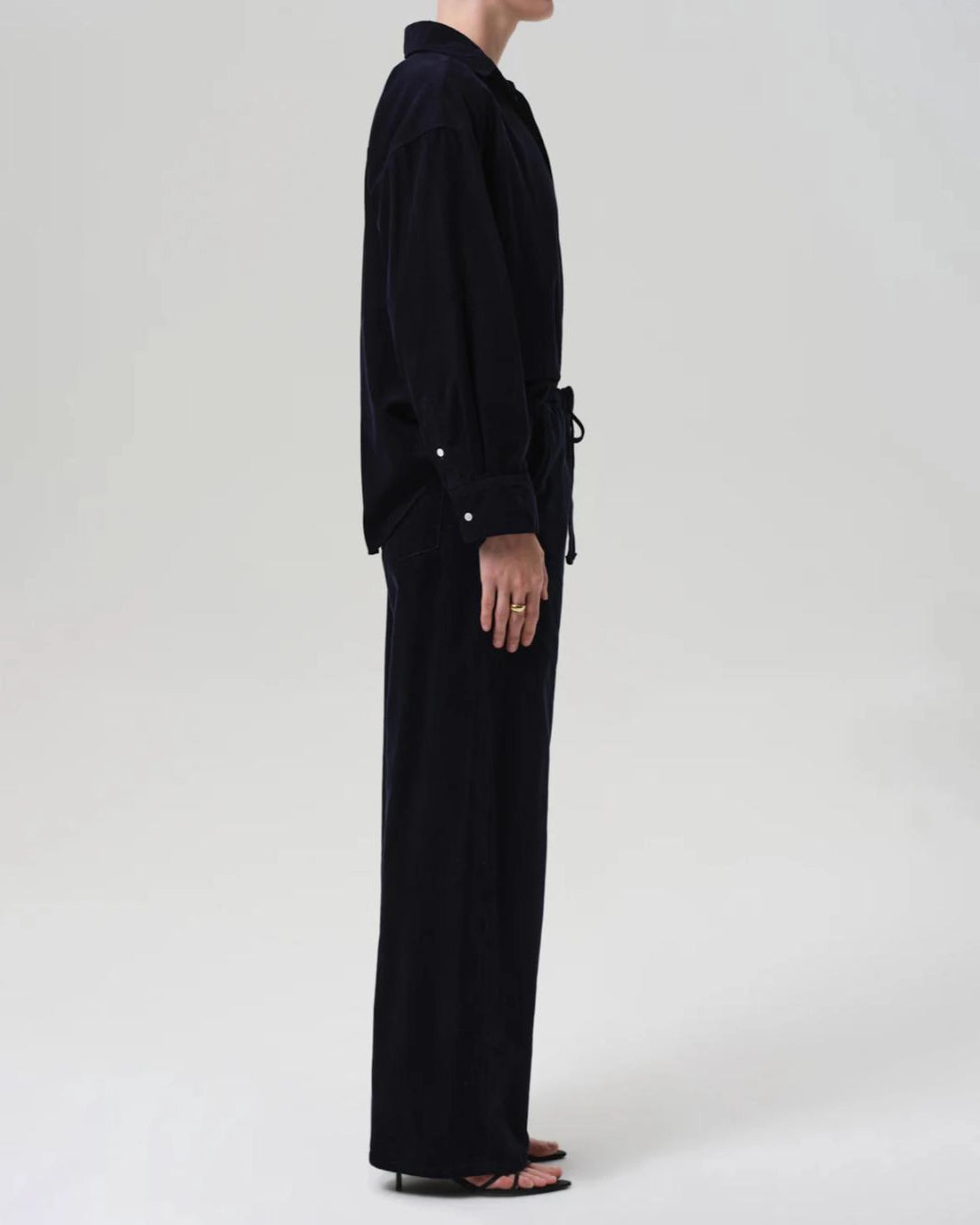 a woman wearing a pair of navy blue corduroy drawstring pants by Citizens of Humanity