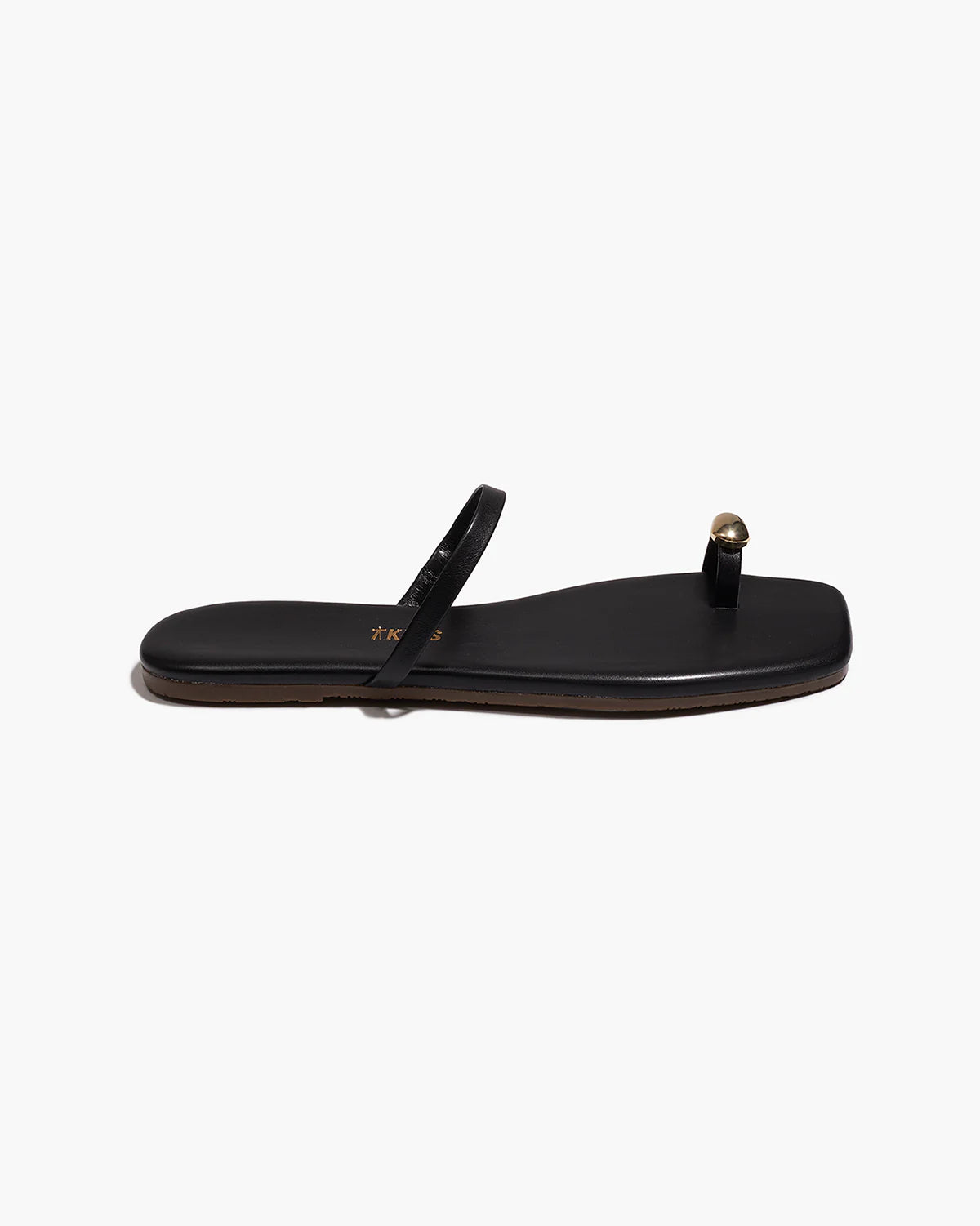 black sandal with gold toe piece