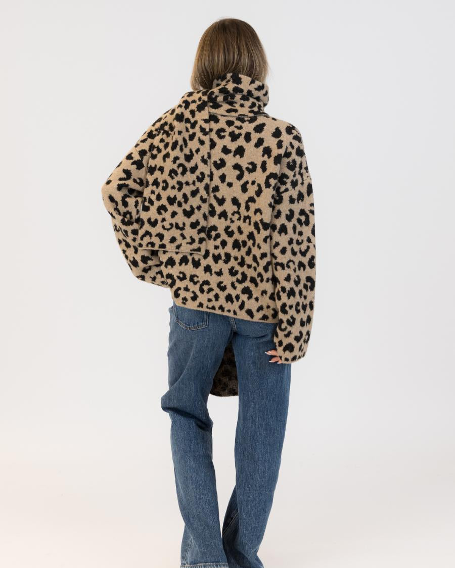 back view of an animal print coat with scarf