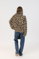 back view of an animal print coat with scarf