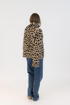 animal print coat with scarf