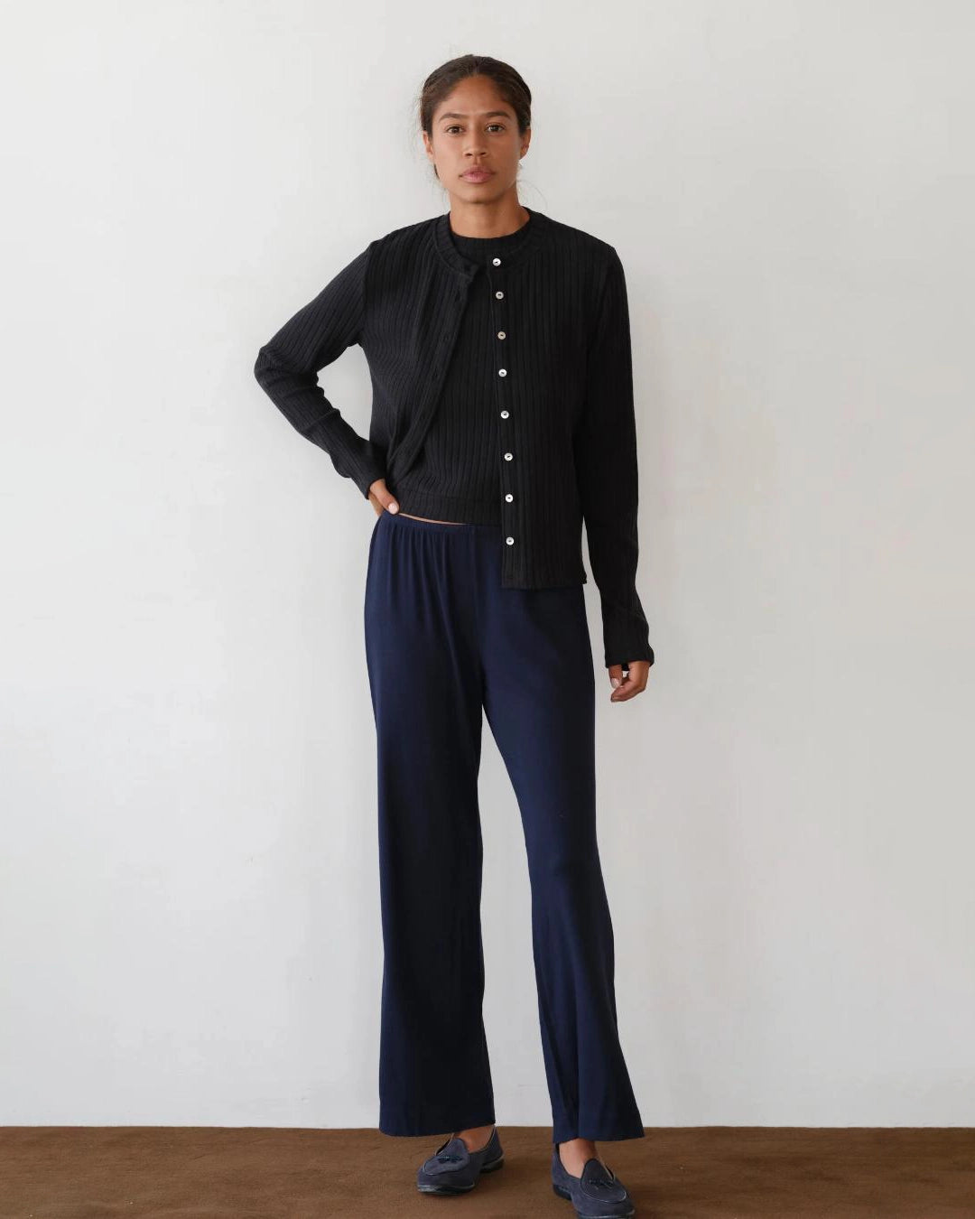 a woman wears a pair of navy blue rib lounge pants