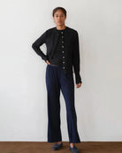 a woman wears a pair of navy blue rib lounge pants