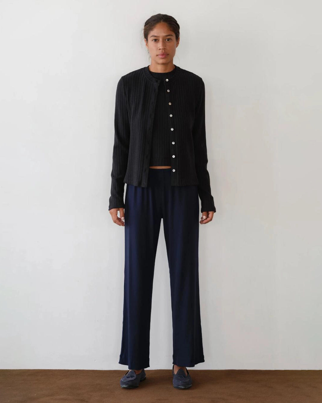 a woman wears a pair of navy blue rib lounge pants