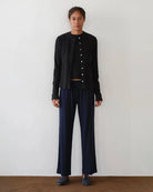 a woman wears a pair of navy blue rib lounge pants