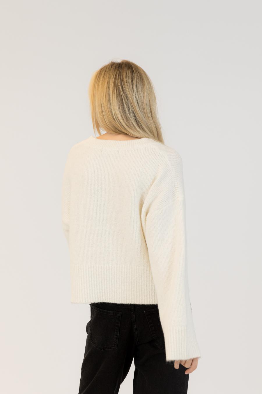 back view of a white sweater