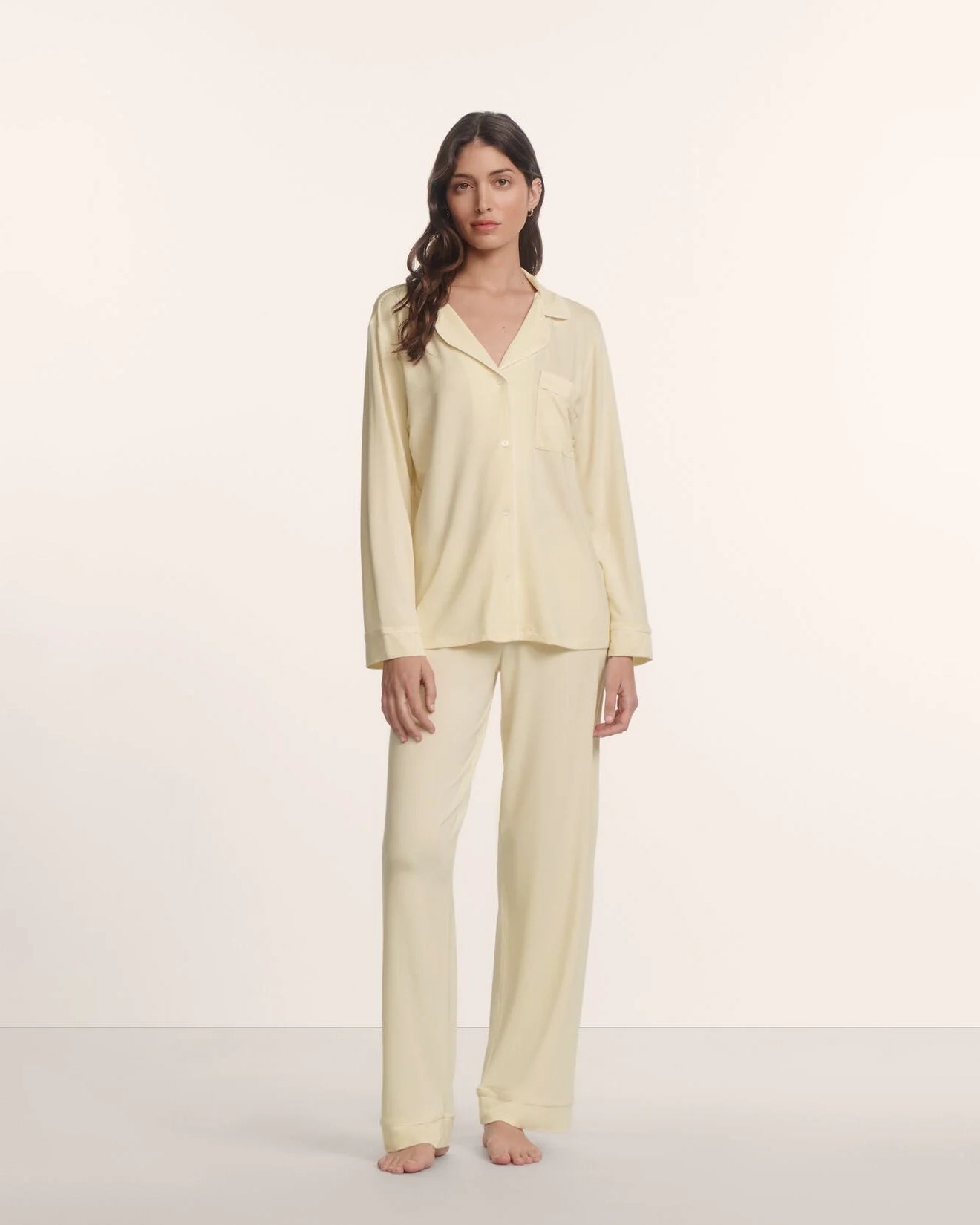 Woman wearing a light yellow pajama set