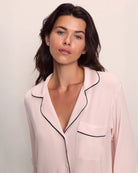 Woman wearing pink tencel and modal pajamas with black piping by Eberjey