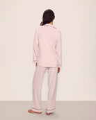 Woman wearing pink tencel and modal pajamas with black piping by Eberjey