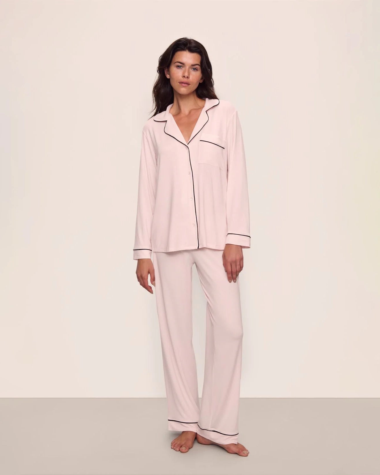 Woman wearing pink tencel and modal pajamas with black piping by Eberjey
