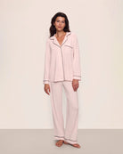 Woman wearing pink tencel and modal pajamas with black piping by Eberjey