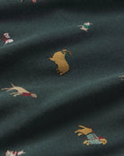 a dark green fabric with a holiday dog pattern