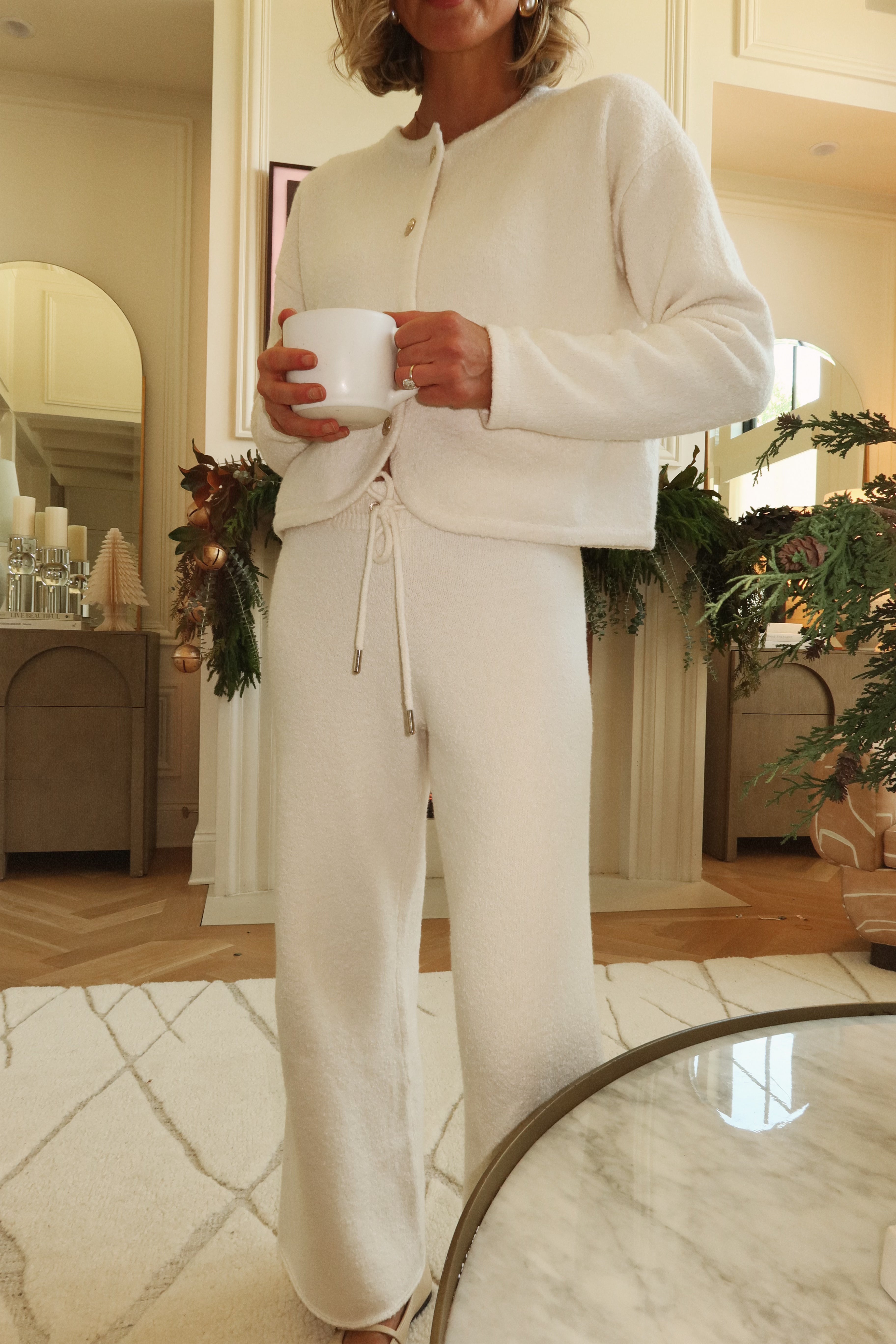 white cardigan with gold buttons