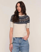 a woman wears a fairisle patterned sweater knit tee