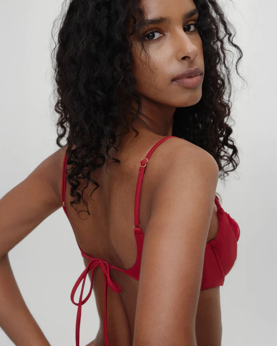 woman wearing frankies bikini austin bikini top in valentine red from the bella hadid collaboration