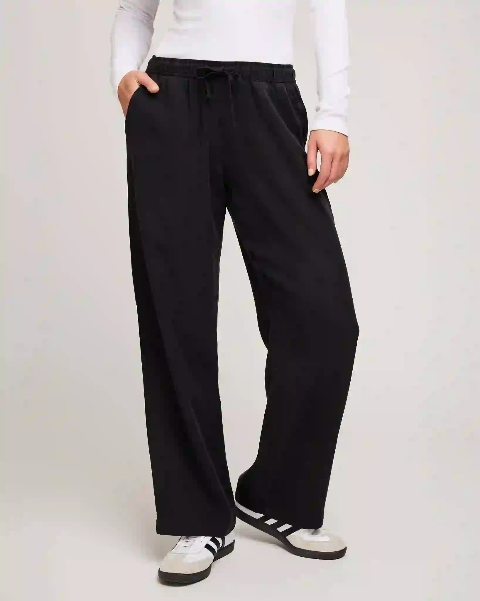 Person wearing black drawstring tencel pants