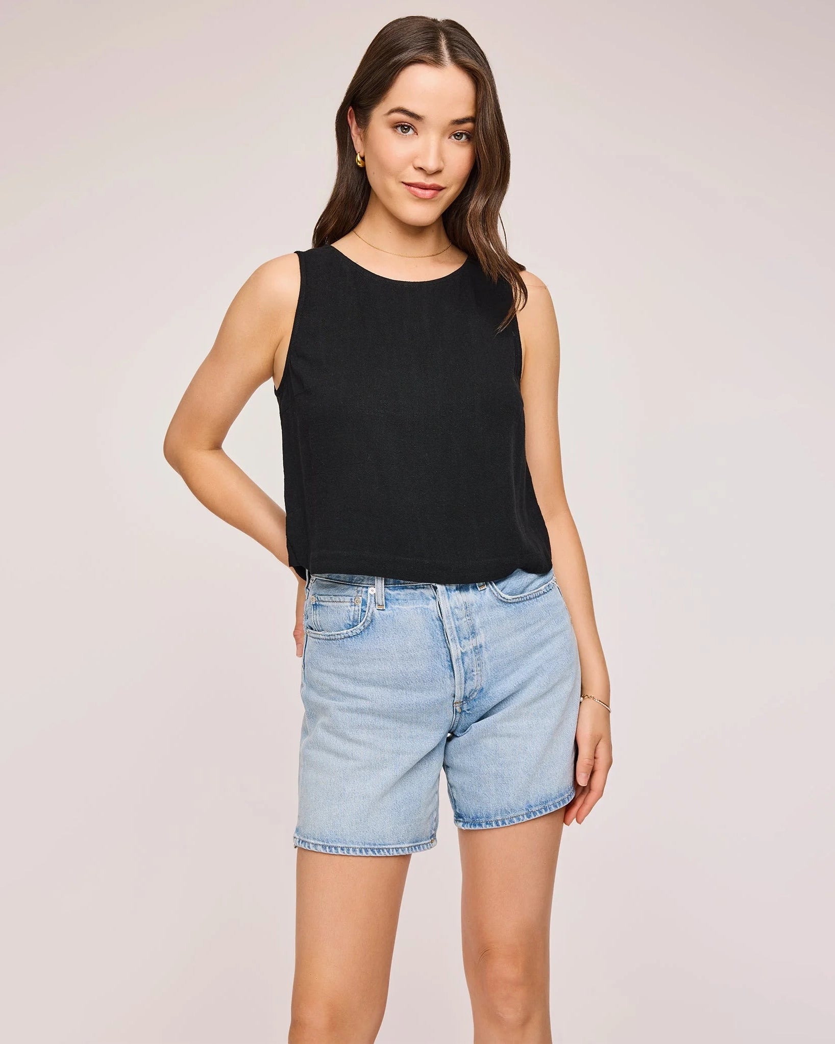 Woman wearing a black sleeveless top