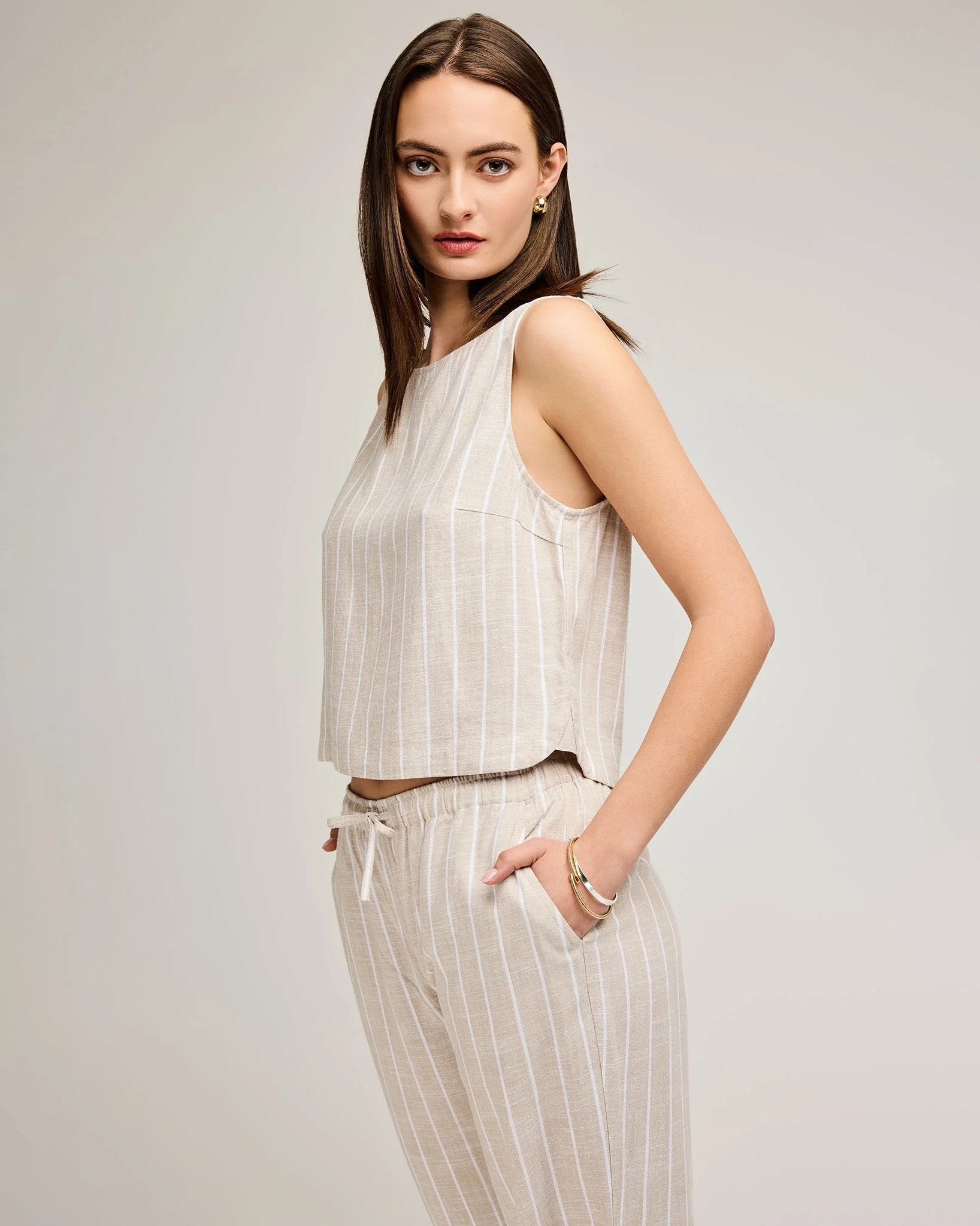 Woman wearing a linen stripe sleeveless top