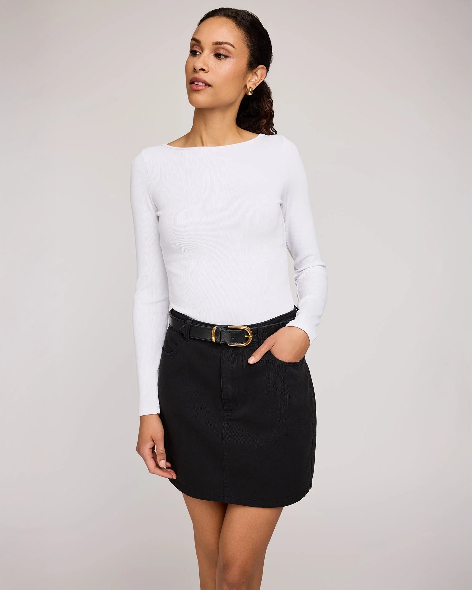 woman wearing cotton twill mini skirt in black colour by Gentle Fawn
