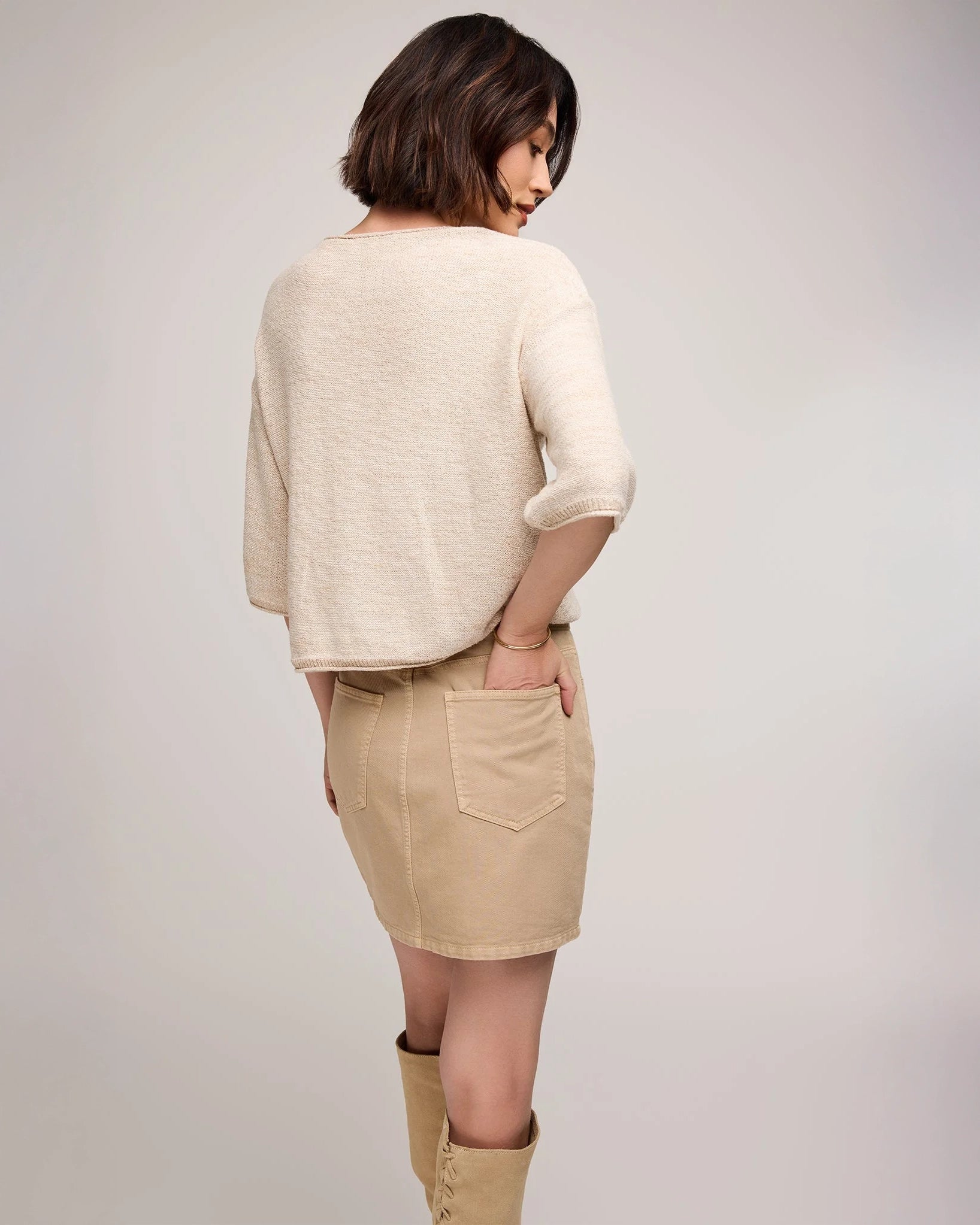 woman wearing cotton twill mini skirt in beige tan colour by Gentle Fawn