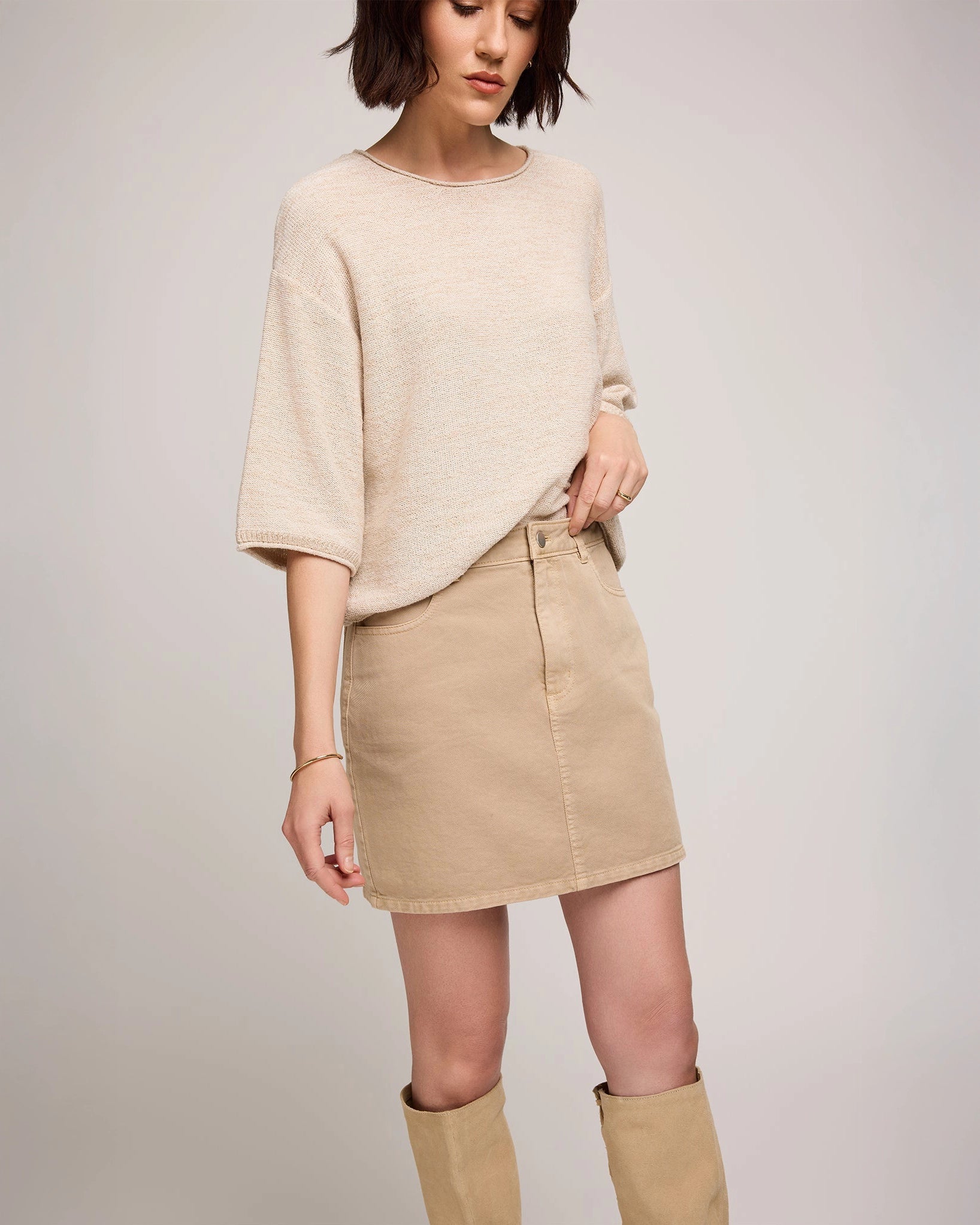 woman wearing cotton twill mini skirt in beige tan colour by Gentle Fawn