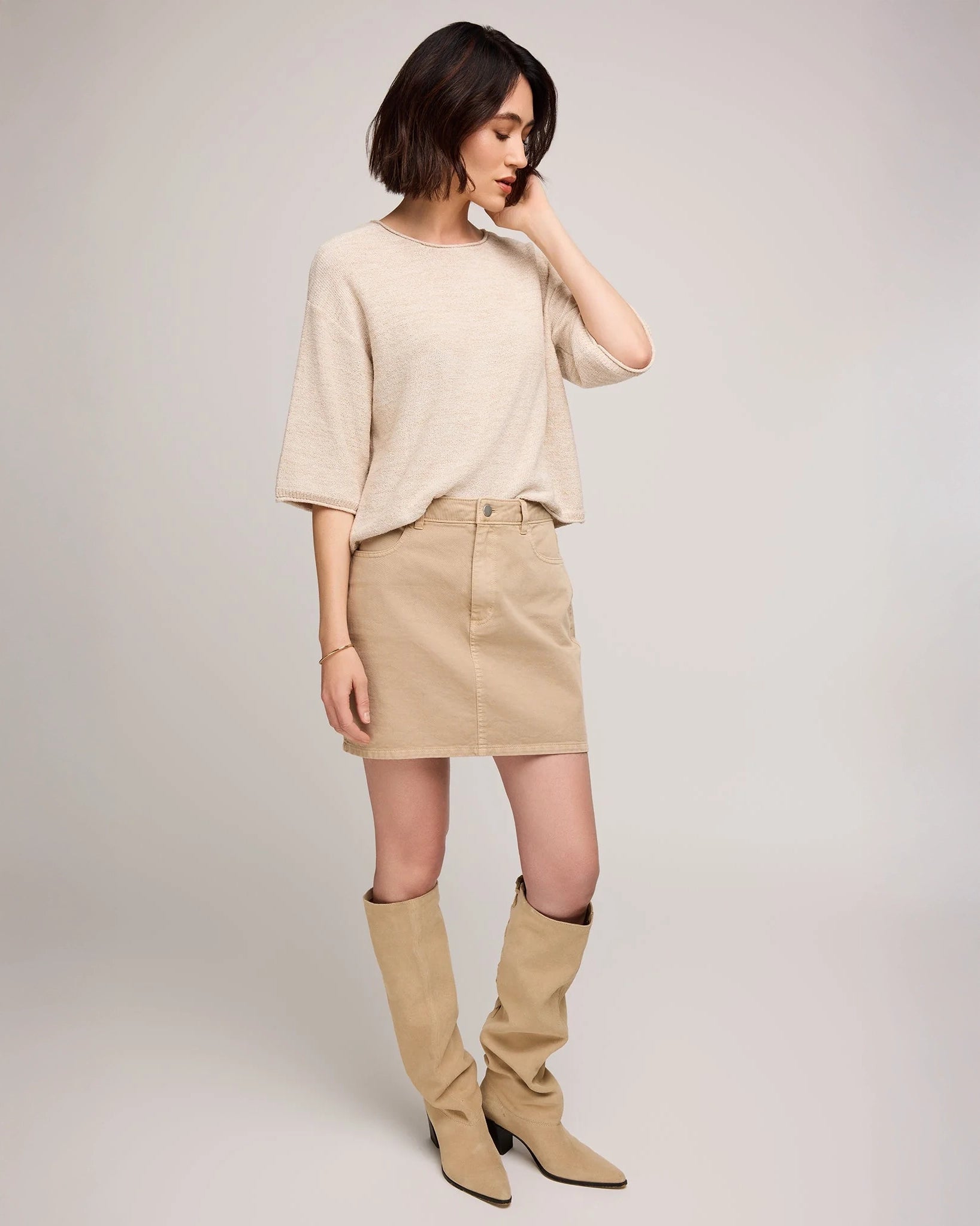 woman wearing cotton twill mini skirt in beige tan colour by Gentle Fawn