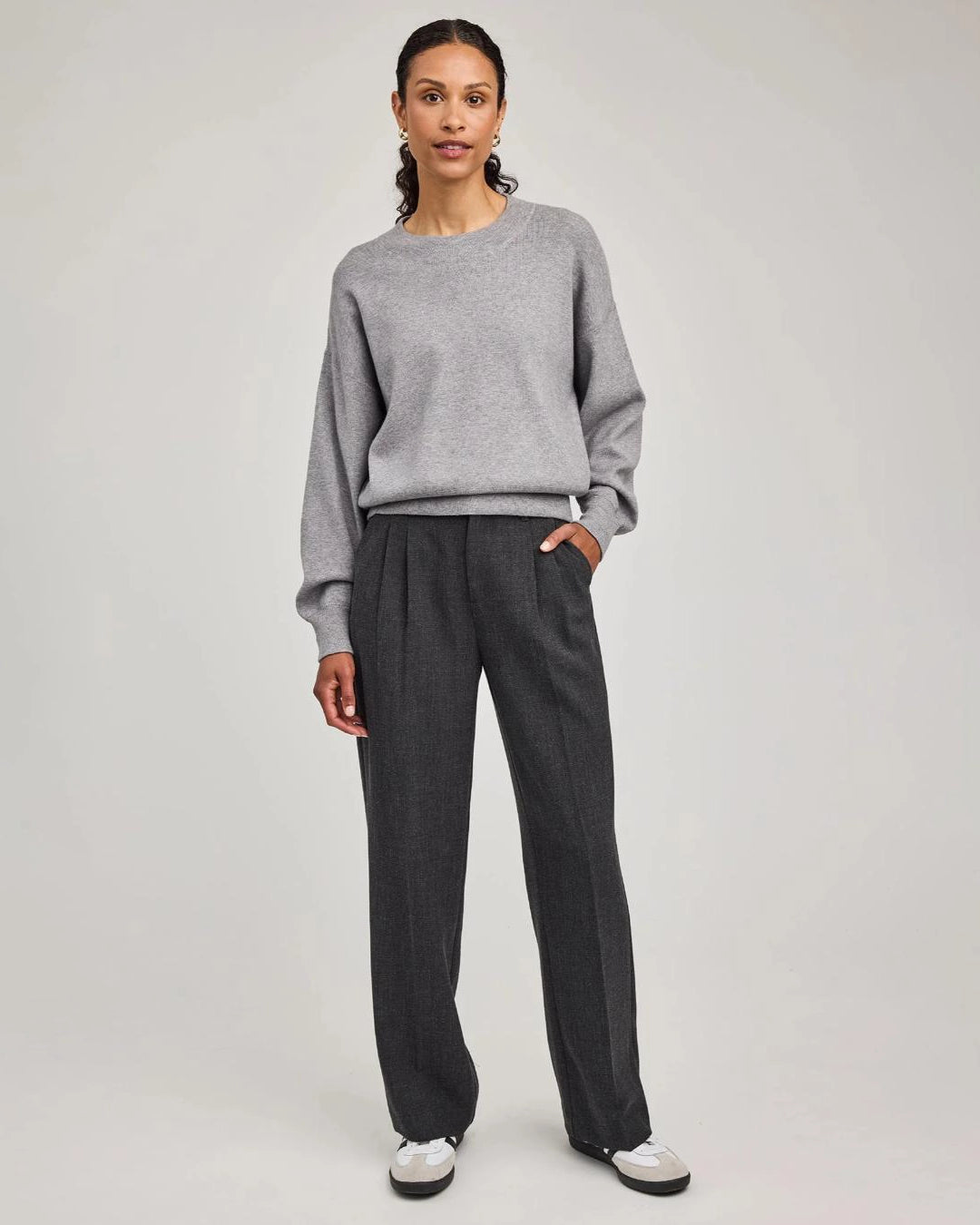woman wearing grey tailored pants wth center pleat