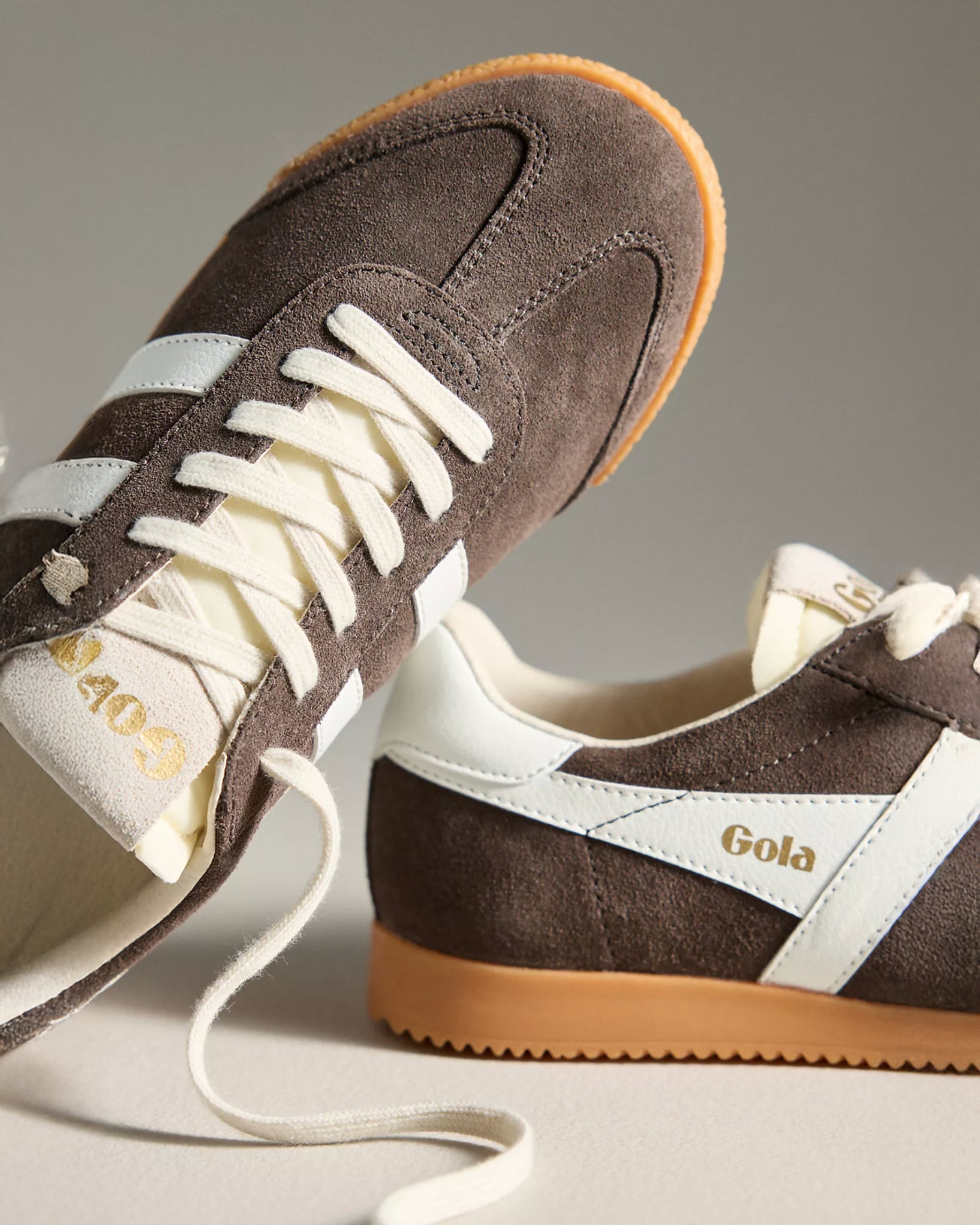 Gola suede sneakers in dark brown with white stripes and a tan rubber sole