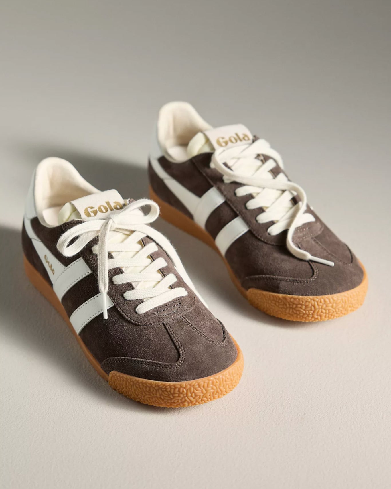Gola suede sneakers in dark brown with white stripes and a tan rubber sole