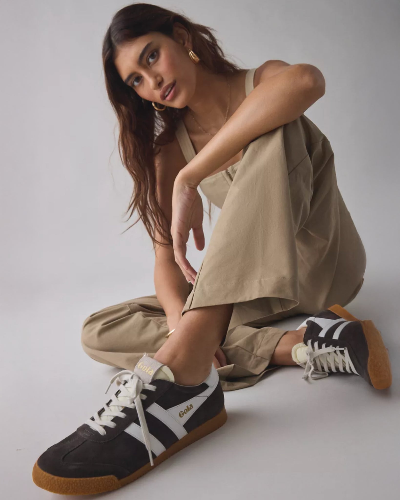 Gola suede sneakers in dark brown with white stripes and a tan rubber sole