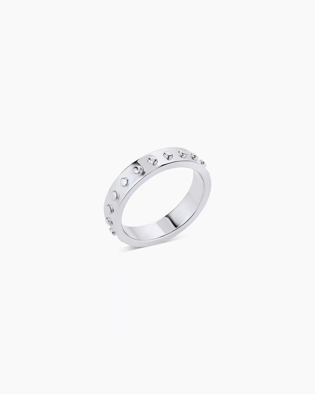 A silver-plated band ring with metallic silver studs and a textured surface.
