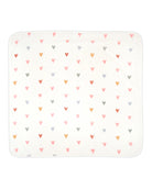 A children's hooded towel with a heart pattern on it