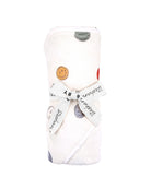 A children's hooded towel with a smiley face pattern on it wrapped up for gifting